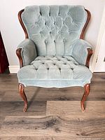 Front view of blue/grey tufted accent chair