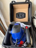 Top-down view of Simoniz polisher in carry case, interior insert visible