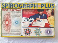 Outer box lid showing Spirograph Plus branding and artwork