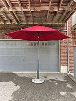 Umbrella fully erected showing canopy, pole and concrete base