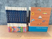 Front view of 10 Childcraft volumes plus separate dictionary