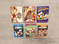 Six DVD cases laid out showing cover art and titles