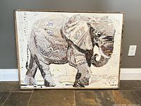 front view of framed elephant mixed media canvas