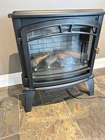 front view of matte black freestanding electric stove fireplace