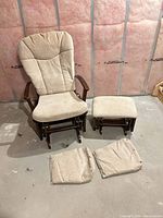 Glider chair, ottoman, two extra cushion covers displayed together