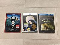 Front covers of all three movie cases