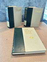 Three hardcover World Book reference volumes displayed