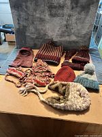 All eight winter accessories laid out on table