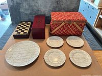 Lot overview: dinnerware, chessboard box, wooden box, picnic basket
