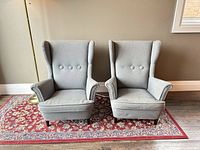 Pair of gray child wingback chairs front view