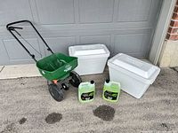 Overall lot showing spreader, two coolers and two de-icer jugs