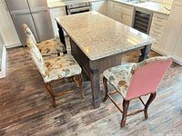 Stools around kitchen island showing overall style and height