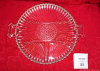 Top view of clear glass divided relish dish showing six sections and two handles