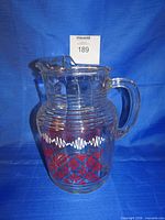 Full view of clear glass pitcher showing overall form and design