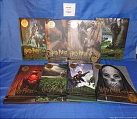 Front view showing all eight Harry Potter Film Vault hardcover volumes