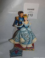 Front view of Jim Shore Disney Traditions Cinderella & Prince Charming figurine with hanging plaque