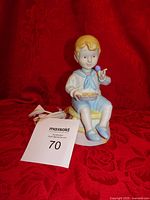 Full view of porcelain Little Jack Horner night light with cord visible