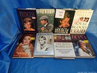 Group shot of all eight royalty books displayed upright
