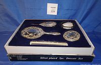 Set in box showing all five pieces