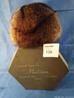 Hat on top of hexagonal Madison box