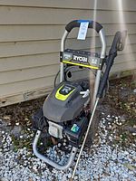 Front view of Ryobi 2900 PSI gas pressure washer with hose and wand attached