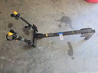 Full view of Saris 2-bike hitch rack lying on garage floor