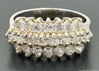 Front view of sterling silver cluster ring showing triple-row clear stones