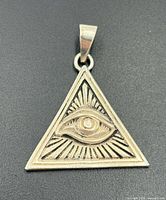 front view showing Eye of Providence engraving and triangular shape
