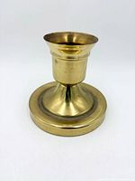 Front view of solid brass taper candle holder