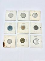 Front view of nine coins in flips