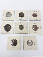 All eight coins in flips displayed on white background