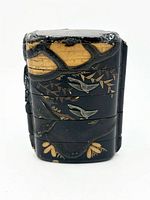 Front view of inro showing decoration and case divisions