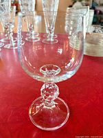 Close-up of Claudia pattern wine glass showing faceted ball stem and bowl