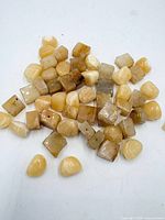 group of honey calcite beads various shapes