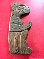 Front view showing carved Bear and Killer Whale motif