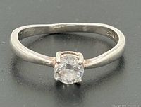 Front view of sterling silver solitaire ring