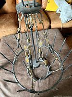 Chandelier angled view showing prongs, central rod and candelabra sockets