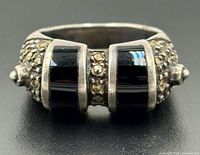 Front view showing two black onyx panels and central marcasite row