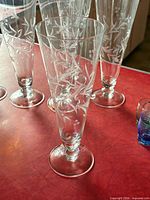 Group of etched crystal stemware glasses showing pattern and shape