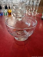 Front view of etched glass bowl showing floral design and shape