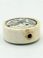 Side view showing thickness, drilled himotoshi and surface patina