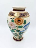 Full view front of Satsuma vase showing floral moriage decoration