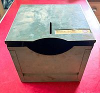 Front view of entire dispenser showing curved opening and label