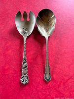 Front view of salad serving fork and spoon