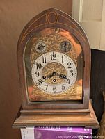 Front view of Seth Thomas mantel clock showing dial and missing door