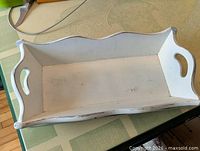 Top view of white distressed wooden knife tray