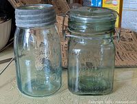 Both sealer jars side by side showing lids and embossing