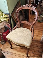 Full view of chair showing frame and upholstery