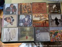 All 12 CDs laid out in three rows of four