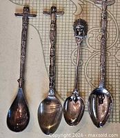 all four spoons laid out showing handles and bowls